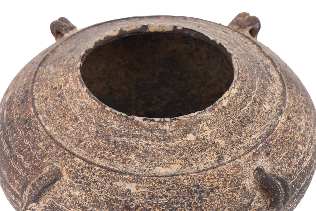 A DARK BROWN EARTHENWARE JAR