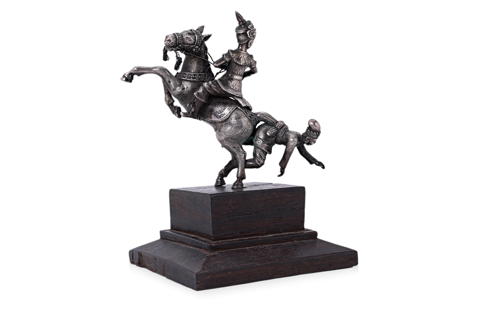 A BURMESE WHITE METAL MODEL OF FIGURES ON HORSEBACK