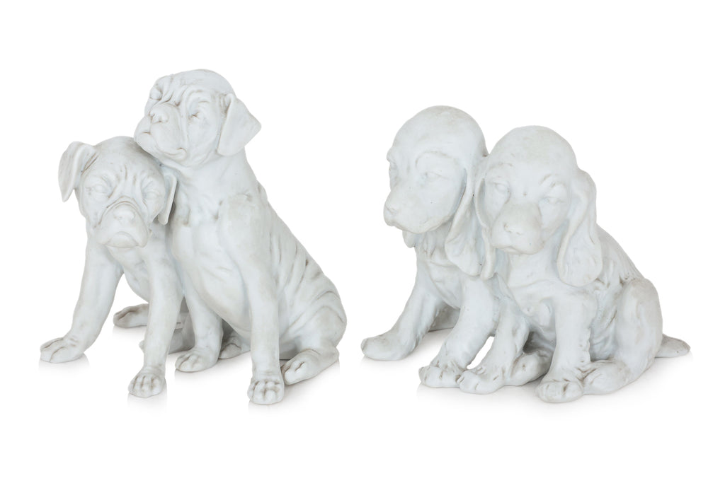 A PAIR OF KAISER GERMAN BISQUE PORCELAIN DOGS