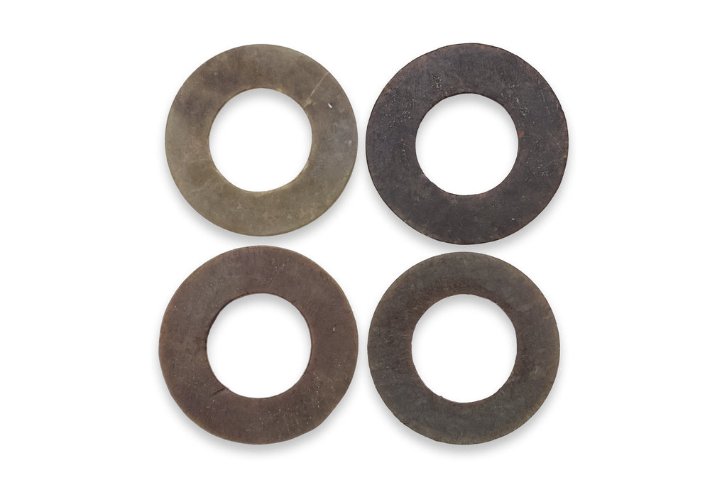 A GROUP OF FOUR JADE DISCS