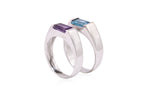 A BLUE TOPAZ RING TOGETHER WITH AN AMETHYST RING