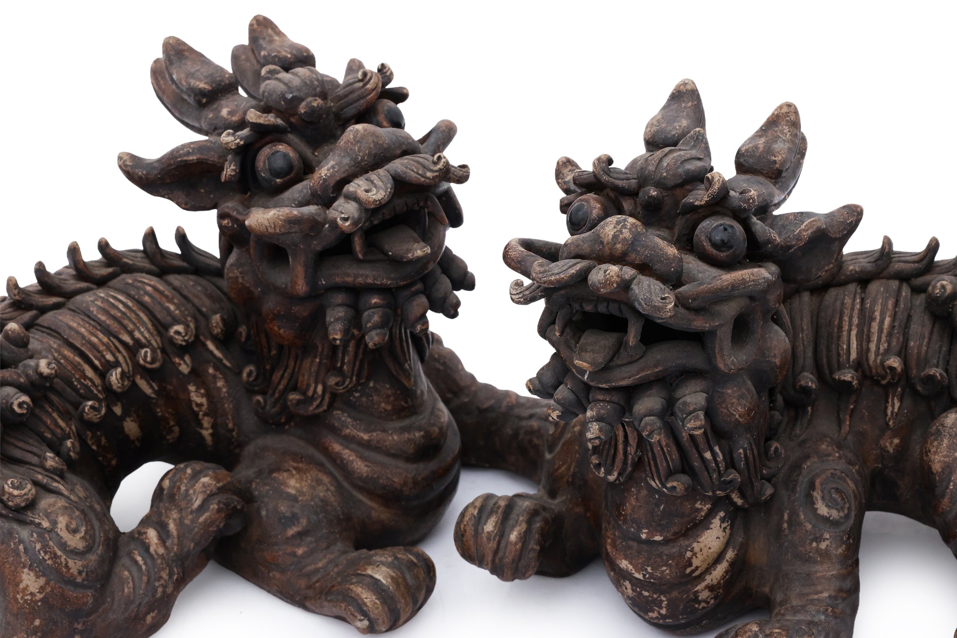 A PAIR OF SHIWAN POTTERY FOO LIONS