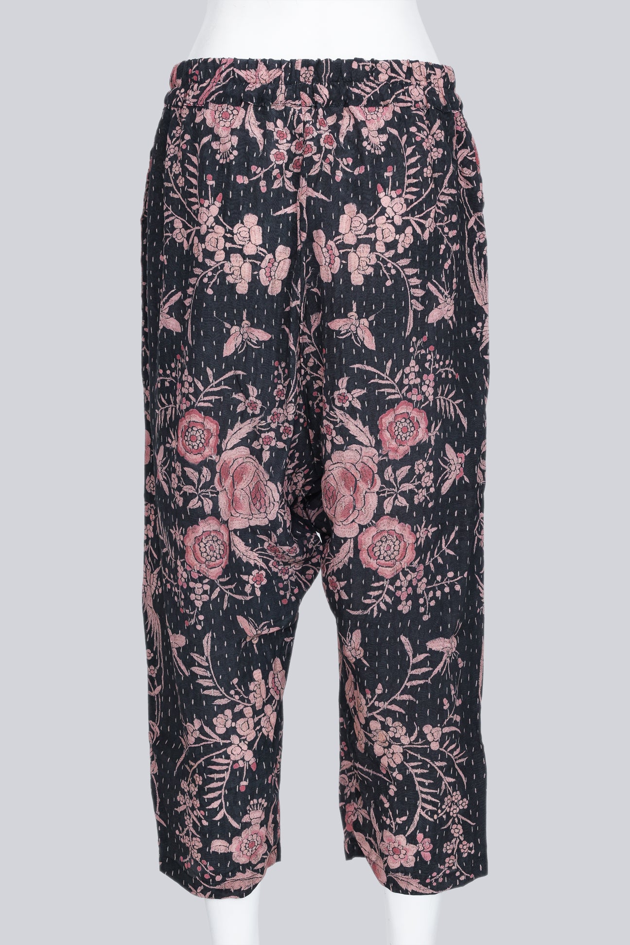 BY WALID - A PAIR OF BLACK AND PEACH FLORAL PRINT DROP CROTCH GAUCHOS
