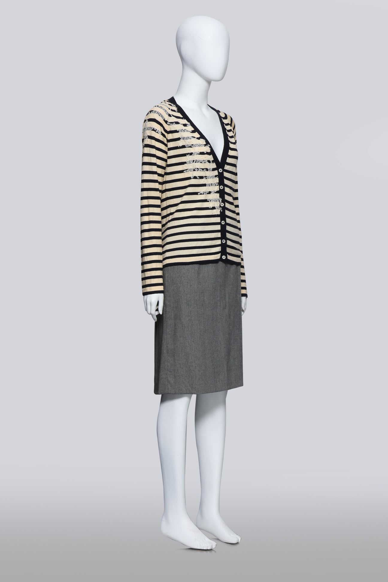 JOHN GALLIANO - A STRIPED CARDIGAN AND GREY SKIRT ENSEMBLE