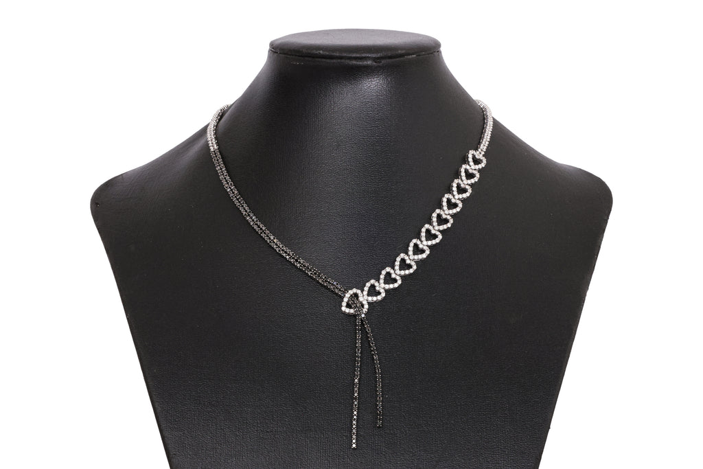 A DIAMOND AND BLACK DIAMOND TWO TONE 'RIBBON' NECKLACE