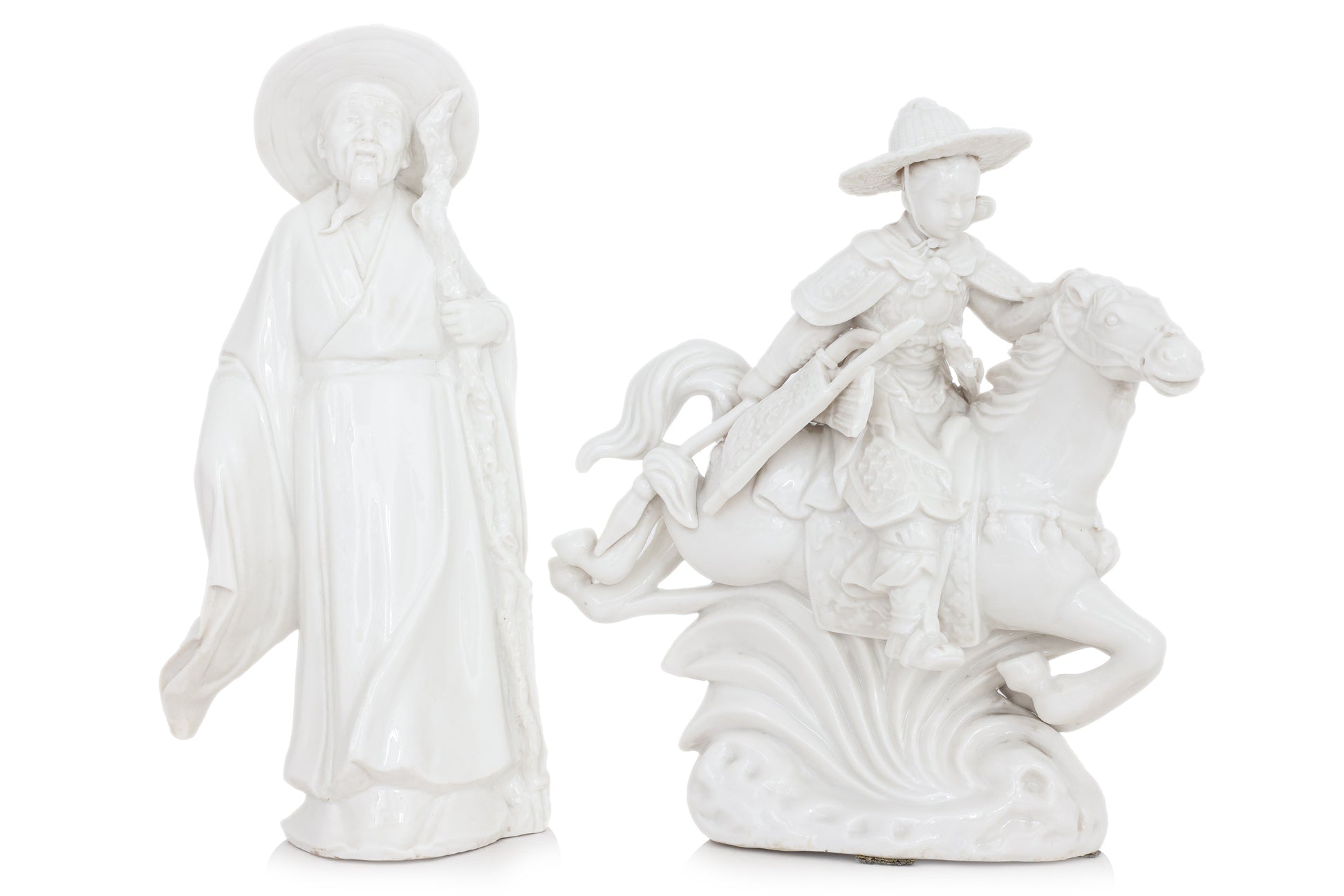A GROUP OF FOUR BLANC DE CHINE PORCELAIN FIGURES