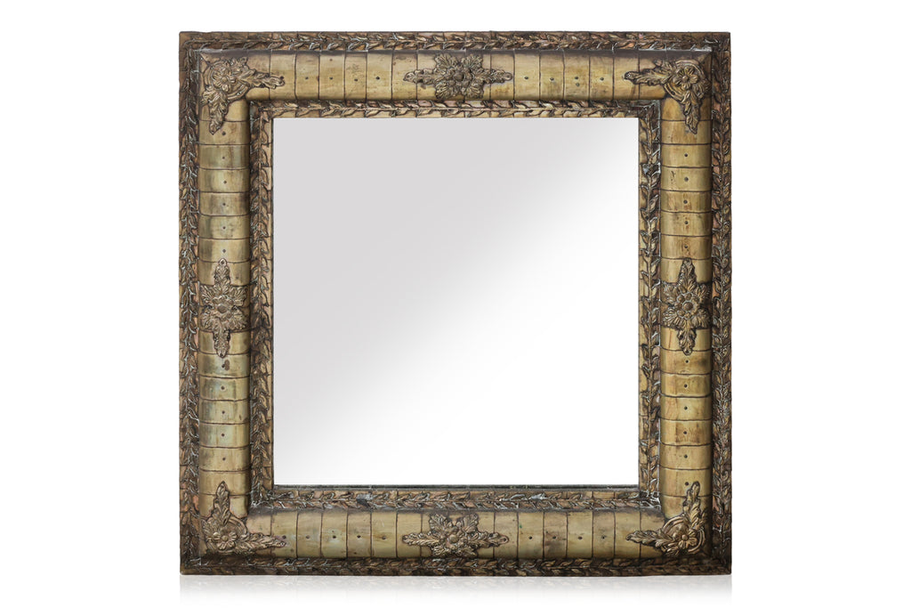 A WHITE METAL FRAMED MIRROR