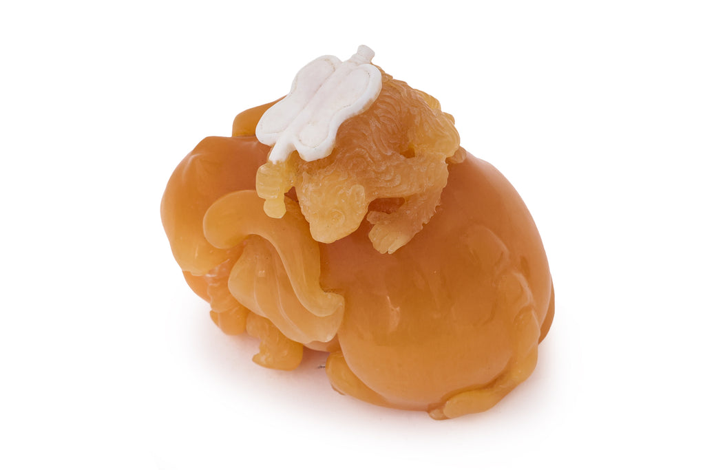 A YELLOW TIANHUANG-TYPE STONE MODEL OF AN ELEPHANT AND MONKEY