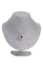 A TOURMALINE AND DIAMOND PENDANT BY JEUNET, WITH A CHAIN