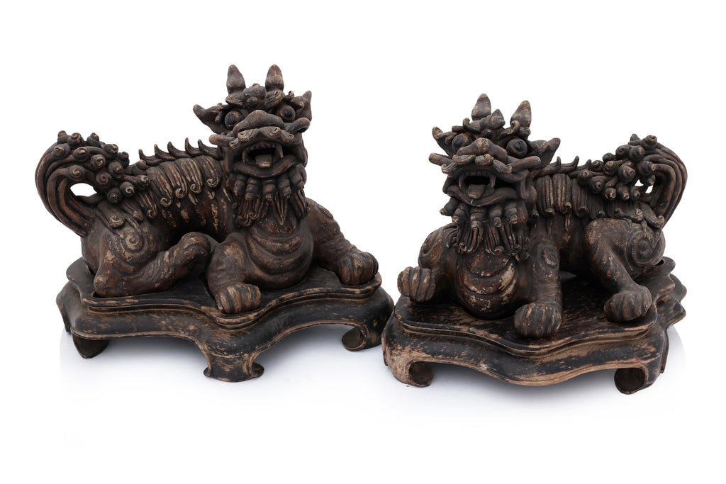 A PAIR OF SHIWAN POTTERY FOO LIONS