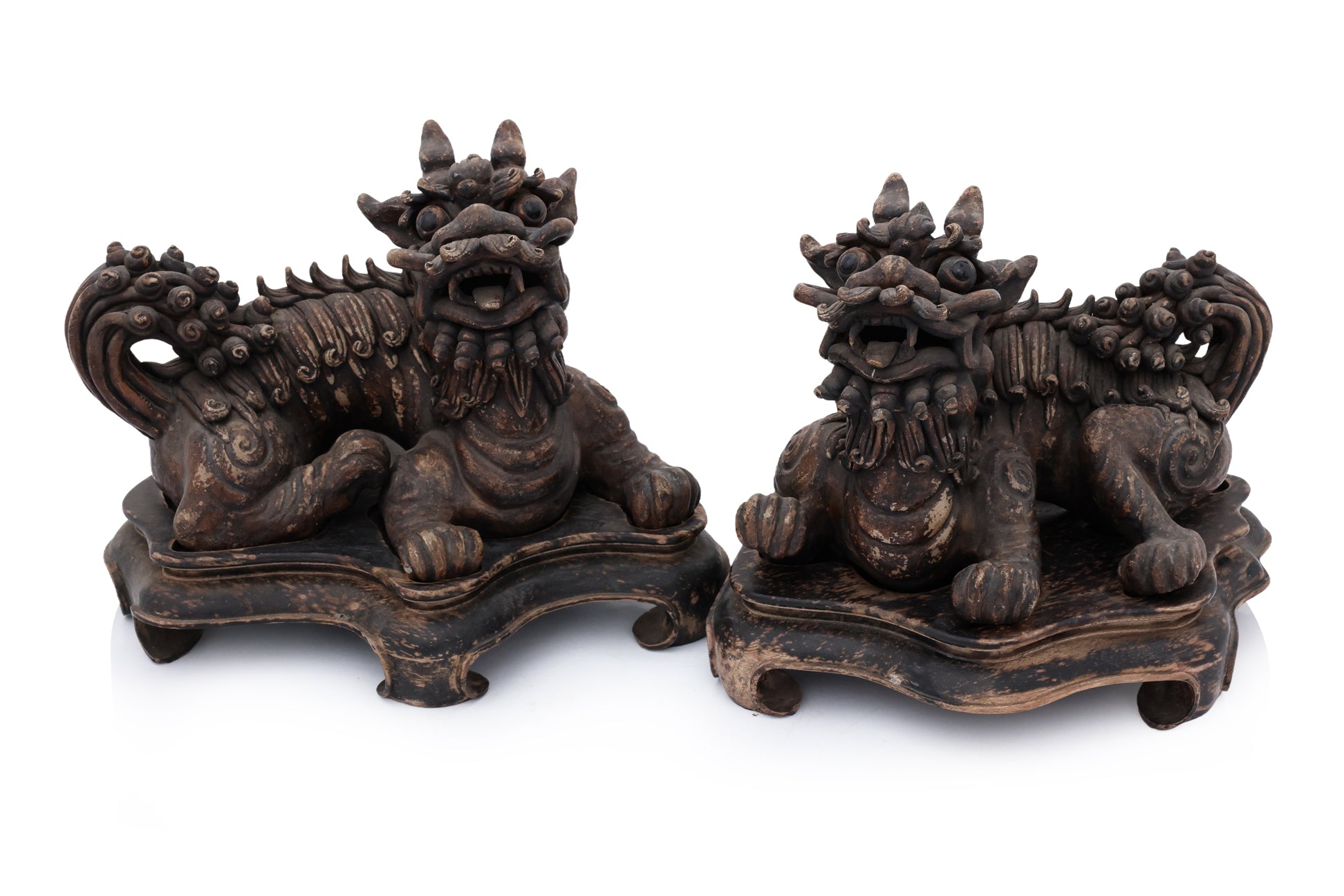 A PAIR OF SHIWAN POTTERY FOO LIONS