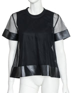 NOIR KEI NINOMIYA - A BLACK POLYESTER AND SYNTHETIC LEATHER TOP, 2017