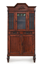 A SMALL GLAZED TEAK CABINET