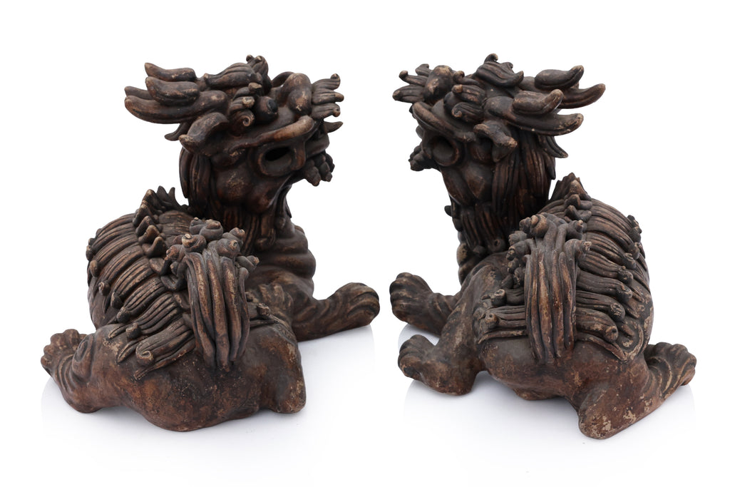 A PAIR OF SHIWAN POTTERY FOO LIONS