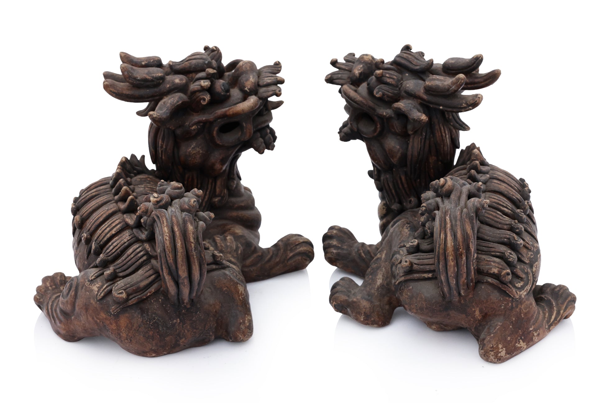 A PAIR OF SHIWAN POTTERY FOO LIONS