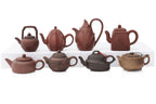 A GROUP OF EIGHT YIXING ZISHA POTTERY TEAPOTS