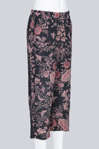 BY WALID - A PAIR OF BLACK AND PEACH FLORAL PRINT DROP CROTCH GAUCHOS