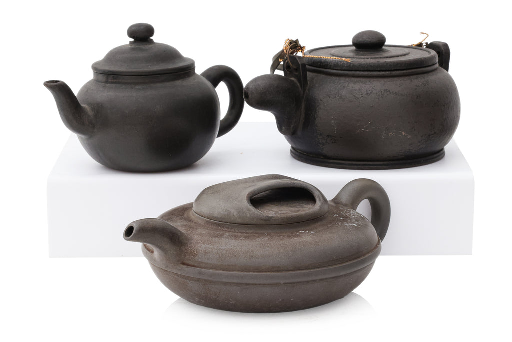 A GROUP OF SIX YIXING ZISHA POTTERY TEAPOTS