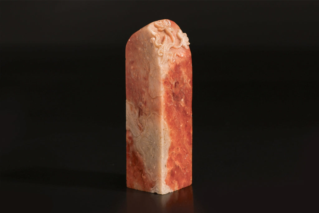 A CARVED SOAPSTONE 'LOTUS' SEAL