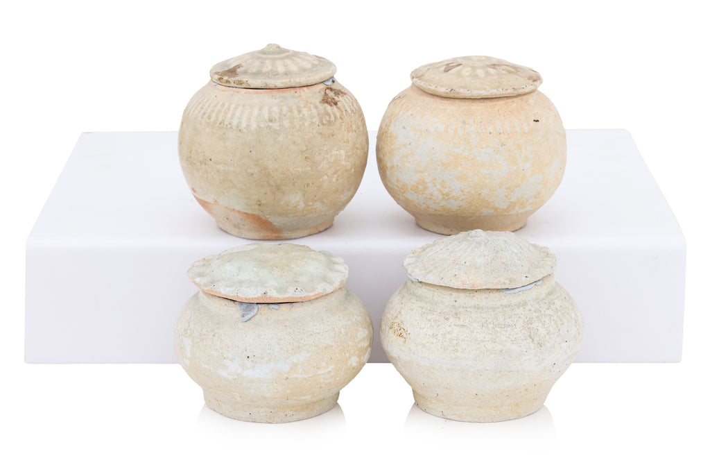 A GROUP OF QINGBAI-GLAZED JARS AND COVERS