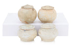 A GROUP OF QINGBAI-GLAZED JARS AND COVERS