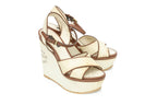 LOUIS VUITTON - A PAIR OF 'ARTICLES DE VOYAGE' SUNLIGHT WEDGE SANDALS