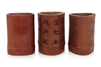 A GROUP OF THREE BAMBOO BRUSH POTS
