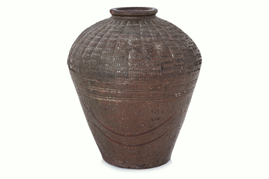 A LARGE SOUTHEAST ASIAN POTTERY JAR