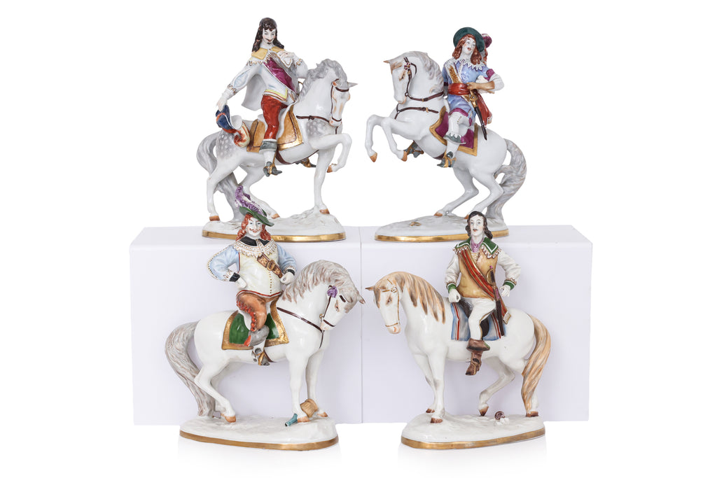 A SET OF FOUR WALLENDORF PORCELAIN FIGURES OF MUSKETEERS