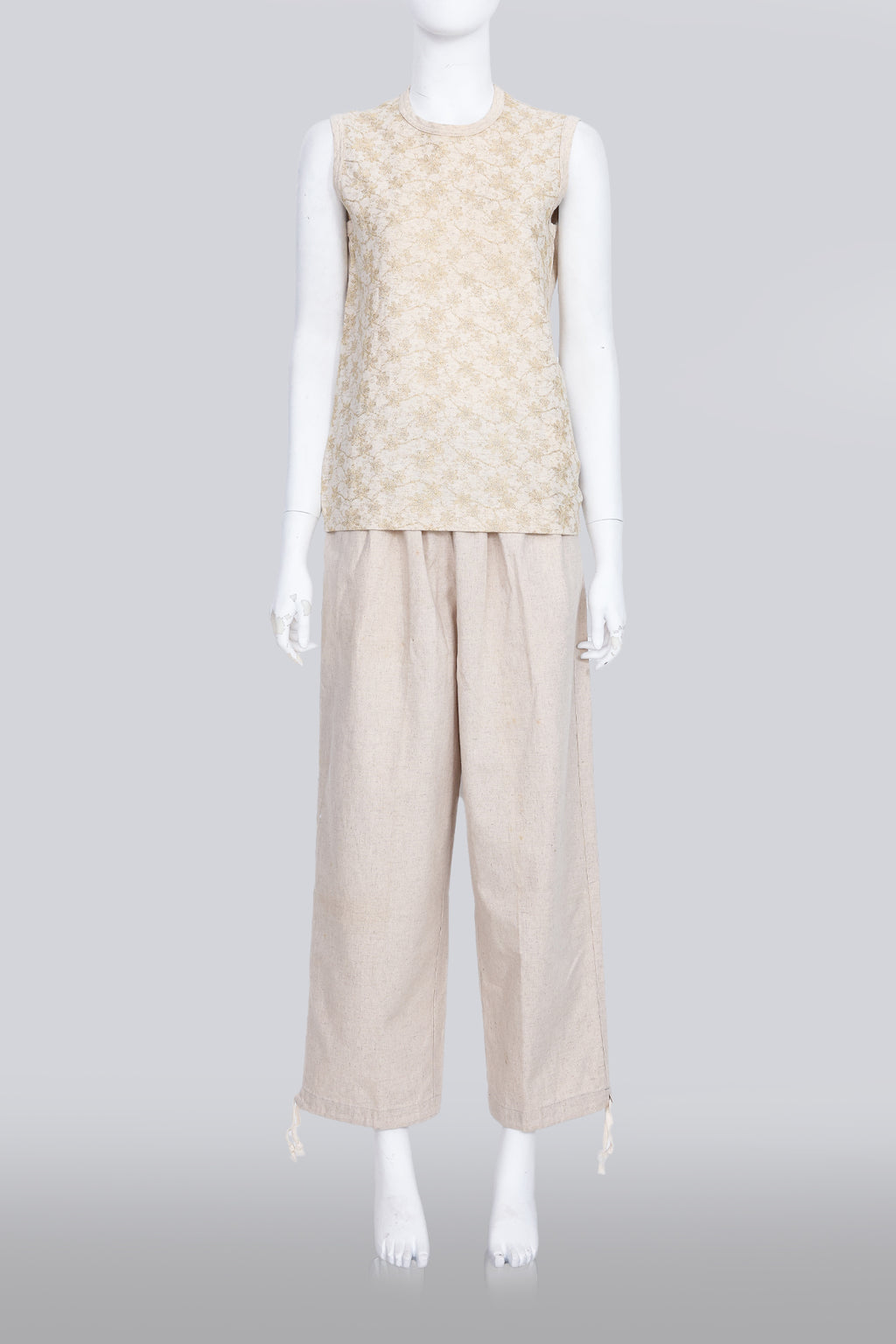 COMME DES GARCONS TRICOT - A 2007 SLEEVELESS TAN GOLD EMBROIDERED SHIRT AND TAN TROUSERS ENSEMBLE