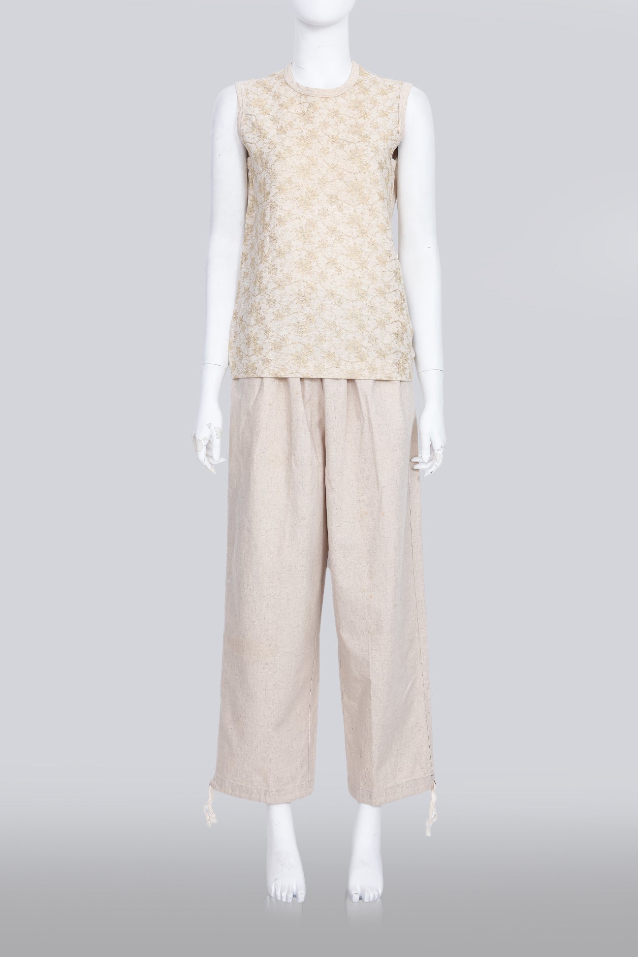 COMME DES GARCONS TRICOT - A 2007 SLEEVELESS TAN GOLD EMBROIDERED SHIRT AND TAN TROUSERS ENSEMBLE