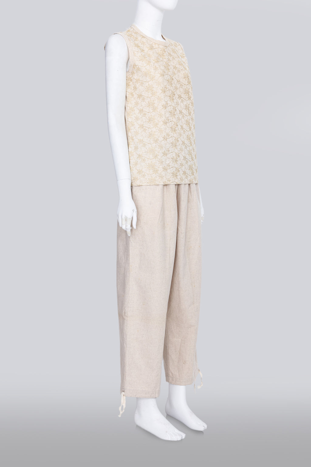 COMME DES GARCONS TRICOT - A 2007 SLEEVELESS TAN GOLD EMBROIDERED SHIRT AND TAN TROUSERS ENSEMBLE
