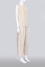 COMME DES GARCONS TRICOT - A 2007 SLEEVELESS TAN GOLD EMBROIDERED SHIRT AND TAN TROUSERS ENSEMBLE