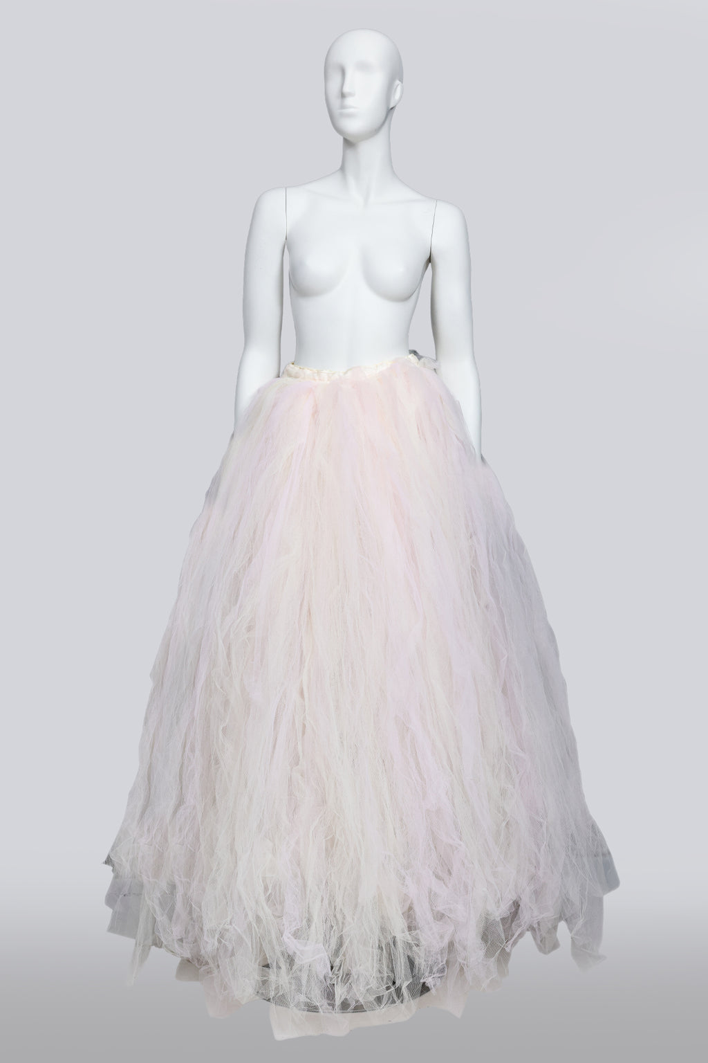 A LARGE PALE PINK AND WHITE TULLE SKIRT