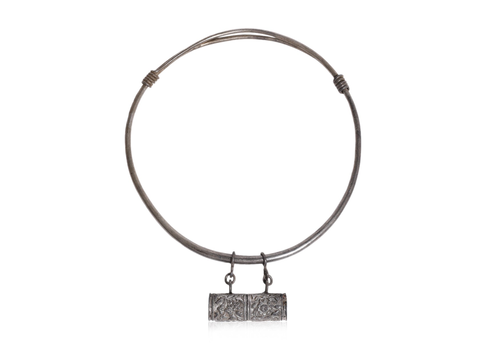 A SILVER TORQUE NECKLACE WITH AN AMULET BOX PENDANT