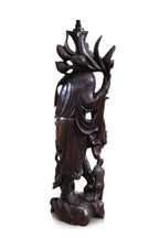 A VERY LARGE CHINESE CARVED HARDWOOD FIGURAL FLOOR LAMP