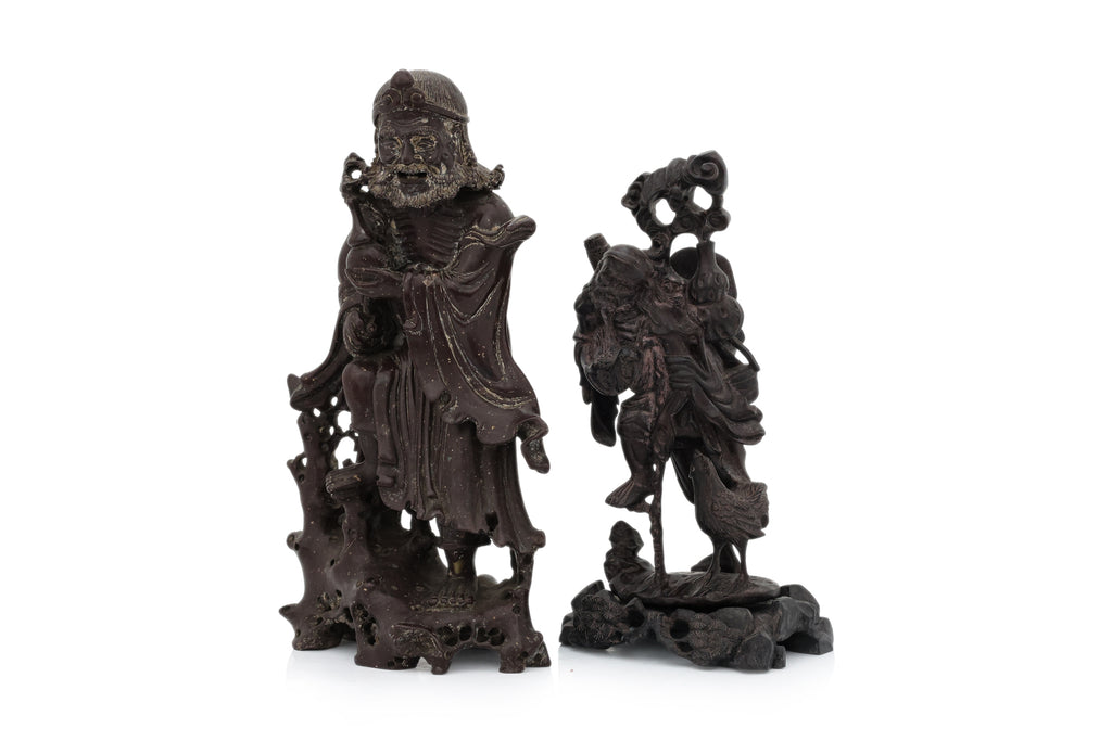 A SOAPSTONE AND A HARDWOOD CARVED FIGURE OF A MONK