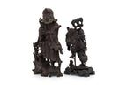 A SOAPSTONE AND A HARDWOOD CARVED FIGURE OF A MONK