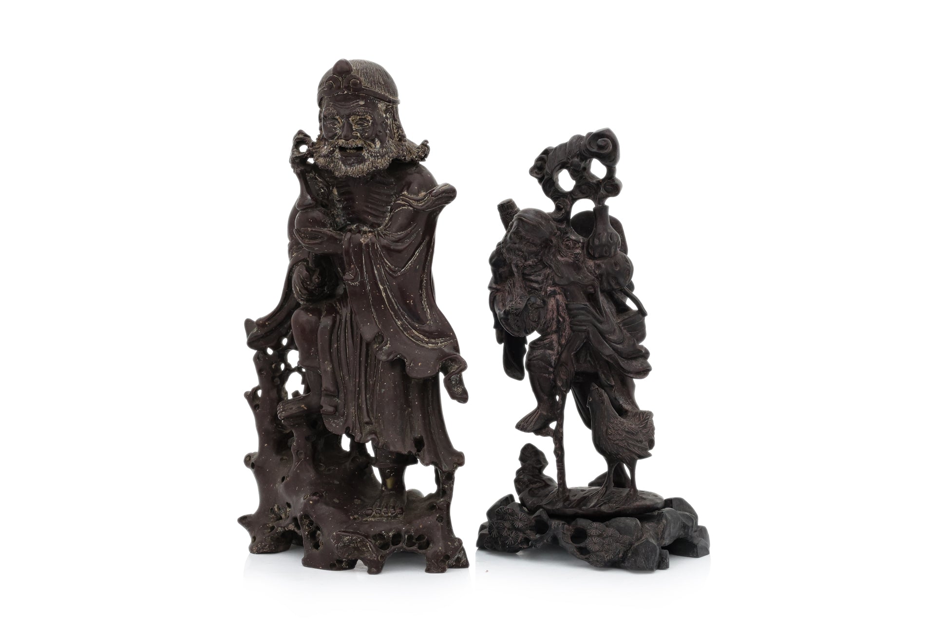 A SOAPSTONE AND A HARDWOOD CARVED FIGURE OF A MONK