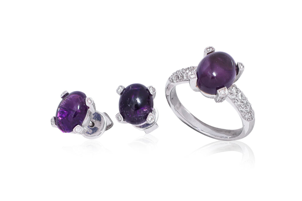 AN AMETHYST AND DIAMOND RING WITH MATCHING EARRINGS