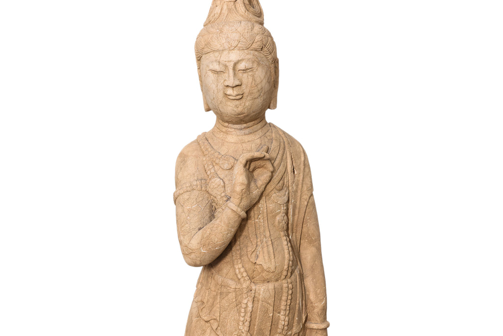 A LARGE CARVED STONE FIGURE OF A STANDING BODHISATTVA
