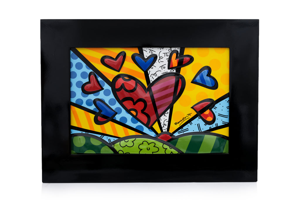 ROMERO BRITTO - A GROUP OF TABLEWARE, A DISNEY FIGURE, AND A PORCELAIN PLAQUE FOR GOEBEL