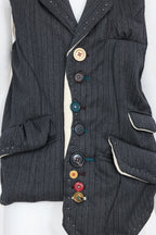 UNDERCOVER JUN TAKAHASHI - AN A/W 2004-2005 SLEEVELESS BLAZER WITH MULTI-COLOURED BUTTONS