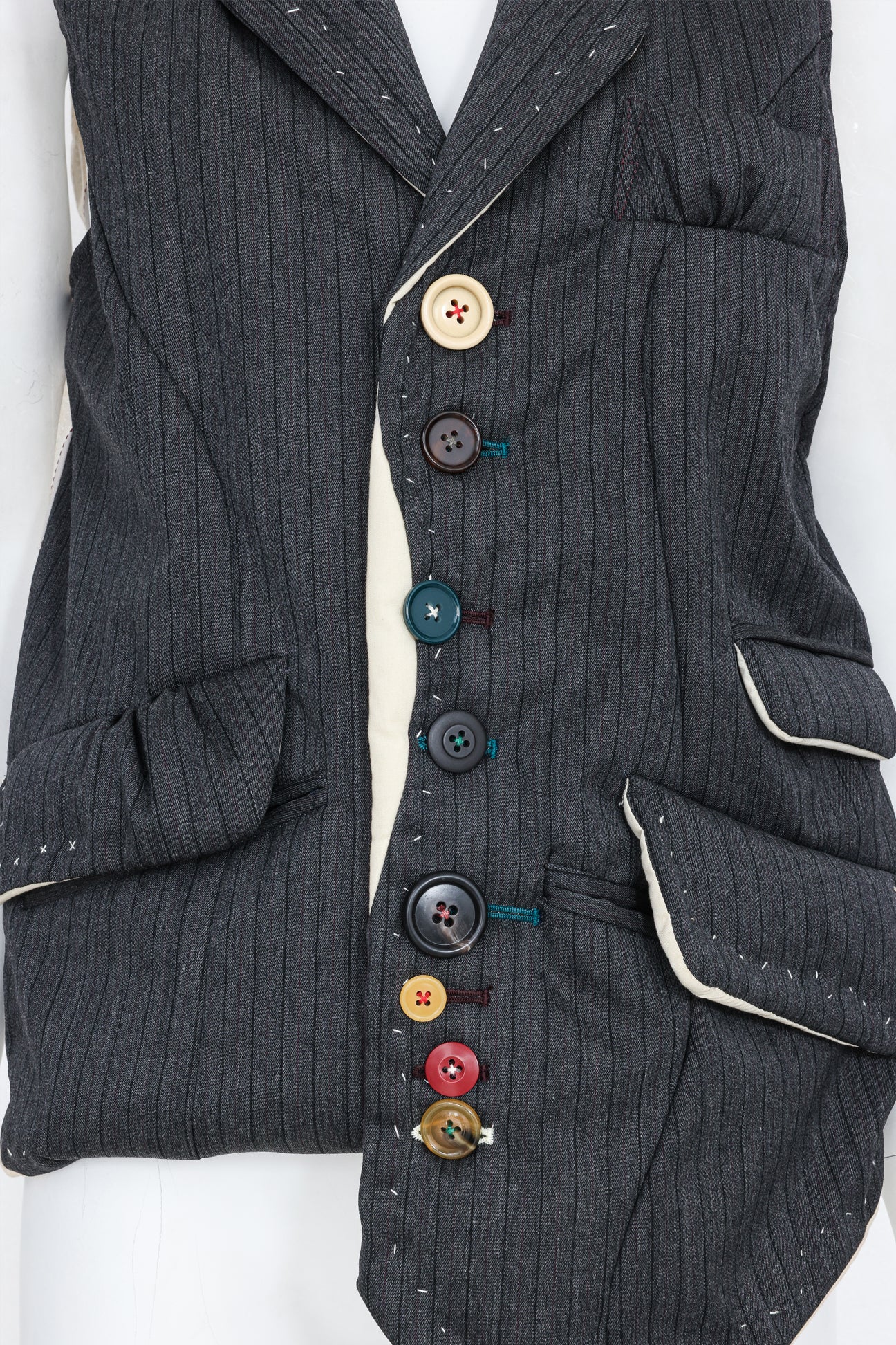UNDERCOVER JUN TAKAHASHI - AN A/W 2004-2005 SLEEVELESS BLAZER WITH MULTI-COLOURED BUTTONS