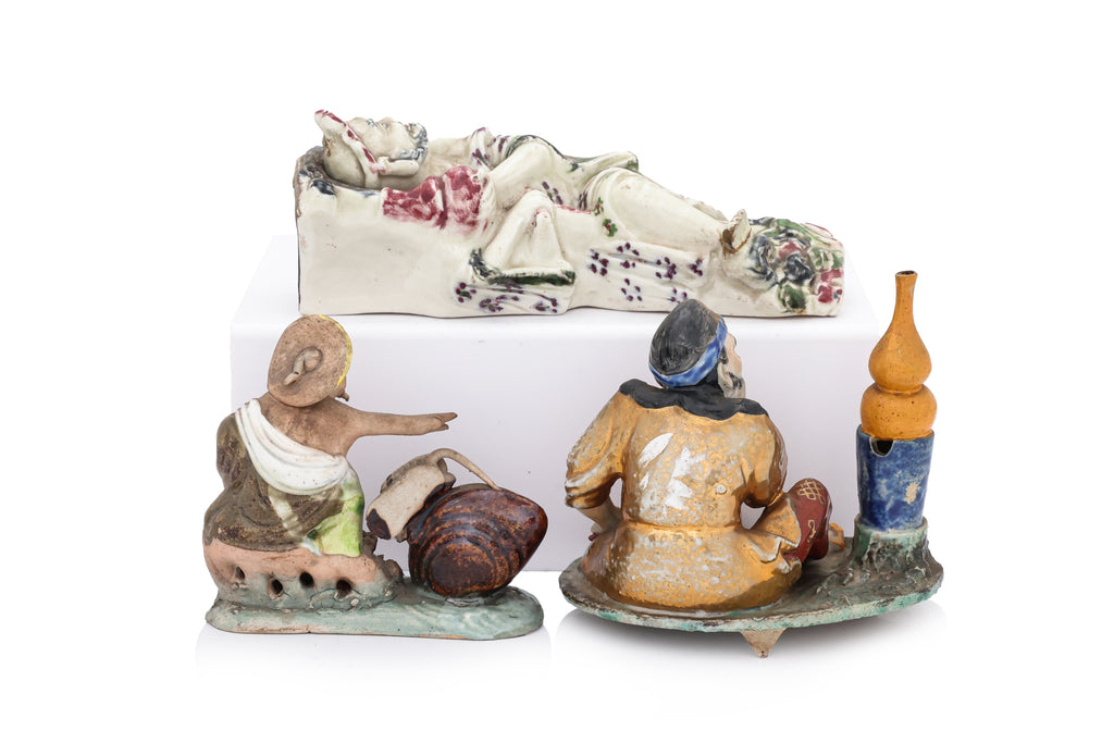 TWO PORCELAIN FIGURES AND A FIGURAL WALL POCKET