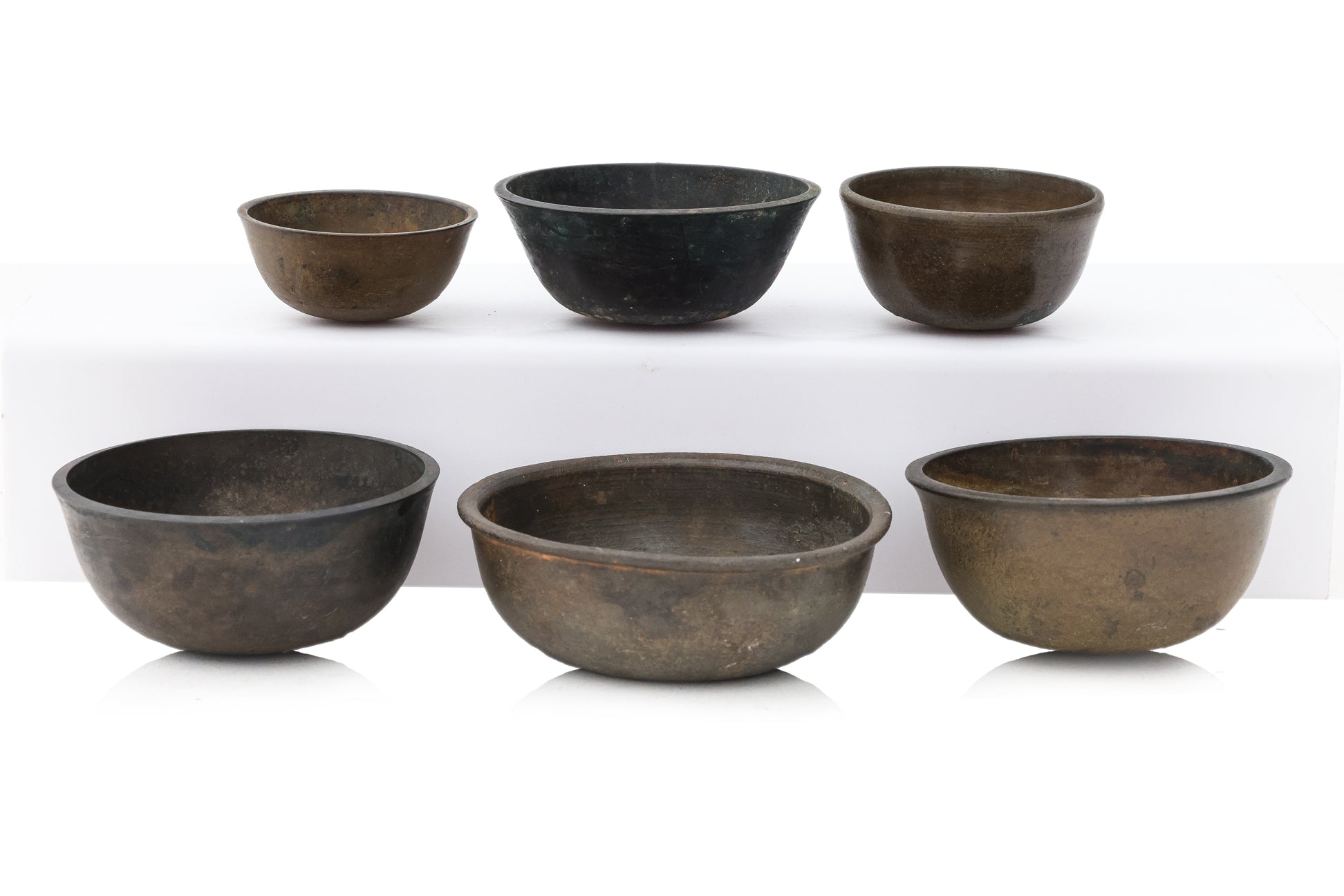 A GROUP OF SIX SOUTH EAST ASIAN BRONZE BOWLS