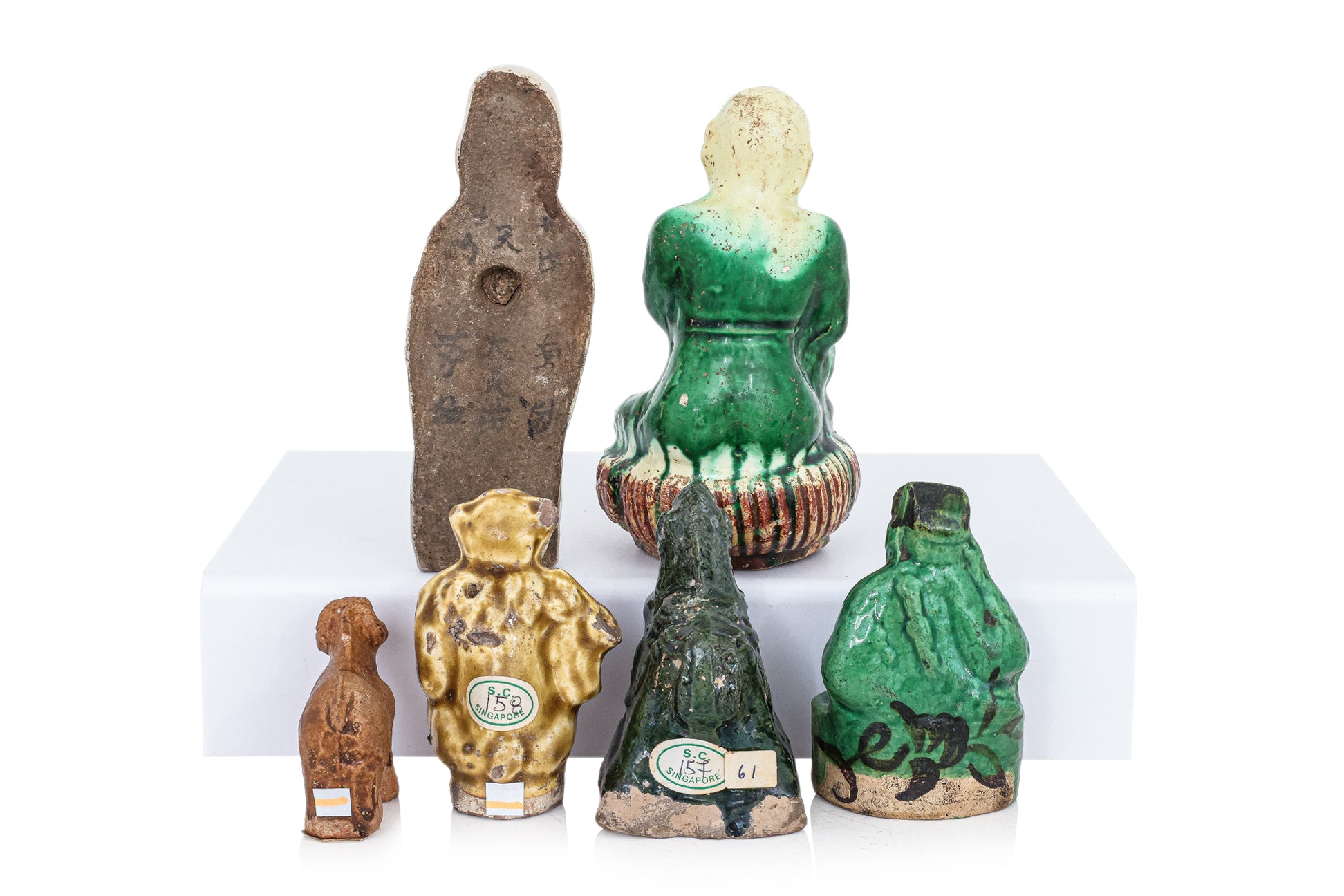 A GROUP OF SIX POTTERY FIGURES