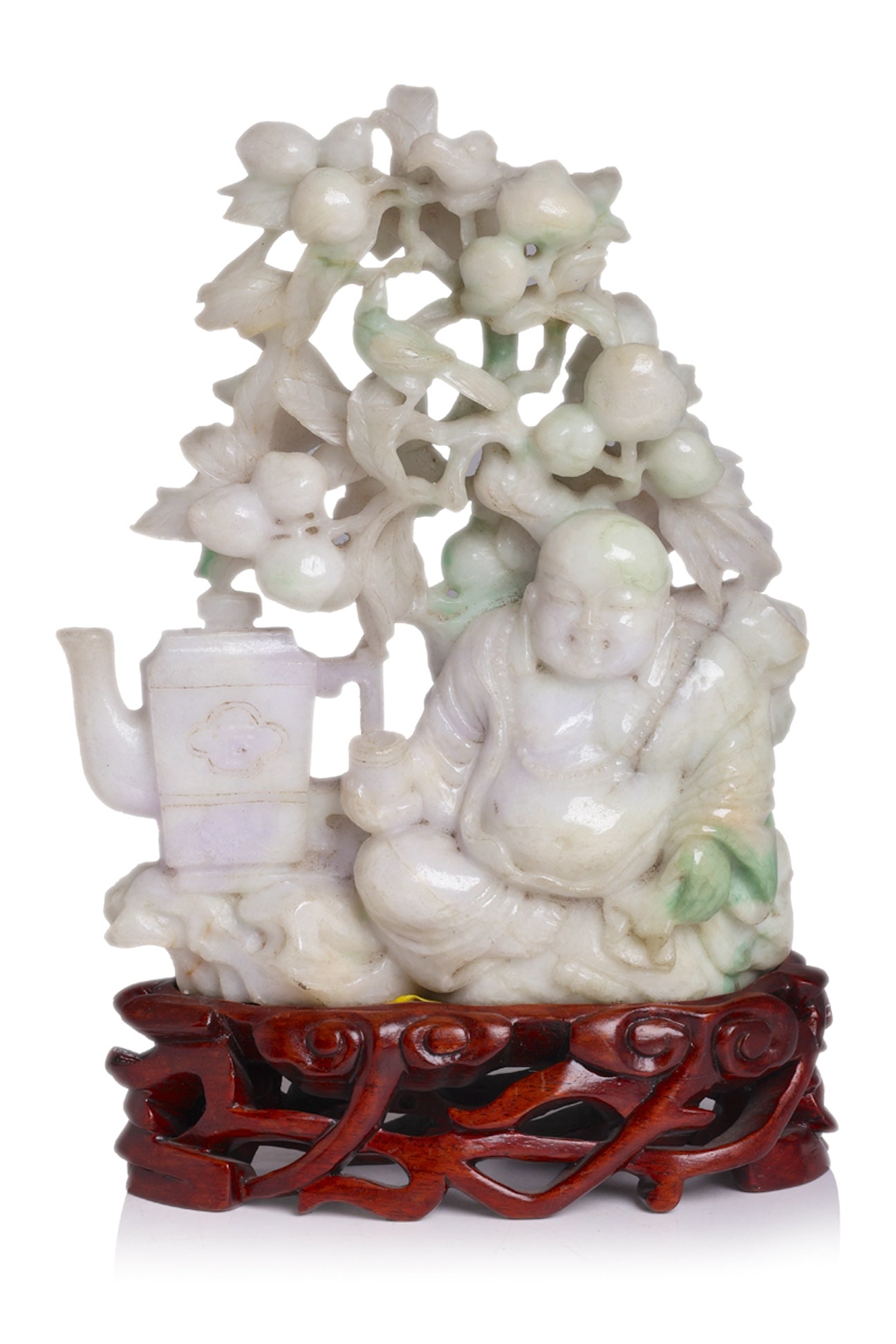 A LARGE JADEITE CARVING OF BUDAI BENEATH A PEACH TREE