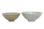 TWO YAOZHOU CELADON GLAZED 'LOTUS' BOWLS