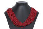 A MULTI-STRAND RED CORAL BEAD NECKLACE